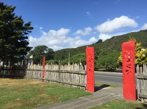 Visitors wait outside the gate until they are called onto the marae.